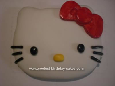 I used an 11X8 pan to carve out Hello Kitty's face. I covered the cake with 