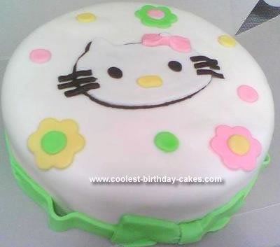 This Homemade Hello Kitty Birthday Cake is a 10" round covered in white 