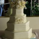 Coolest Ivory Wedding Cake with Ranculus and Lilly Flowers