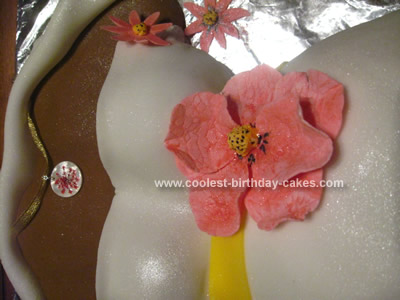 Coolest Hibiscus Flower Pregnant Belly Cake